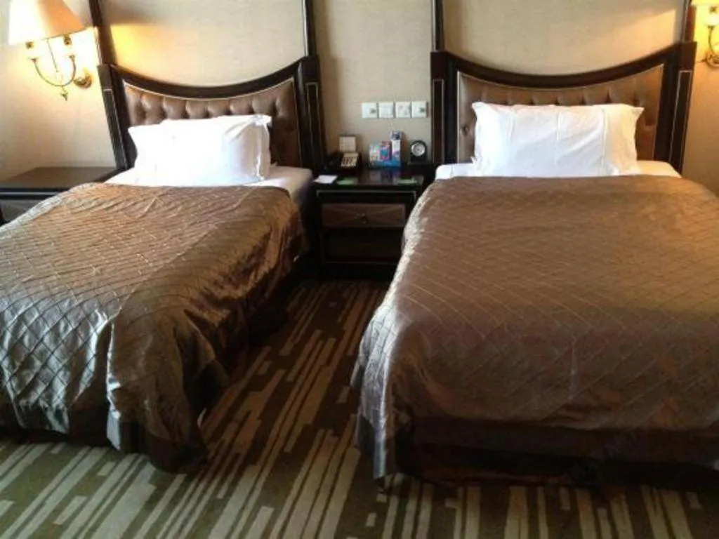 Bed in Qingdao Danube International Hotel