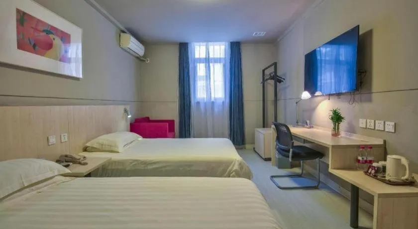 Bed in Jinjiang Inn Taizhou Huangyan Jiufeng Park