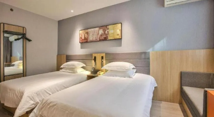 Bed in Jinjiang Inn Taizhou Huangyan Jiufeng Park