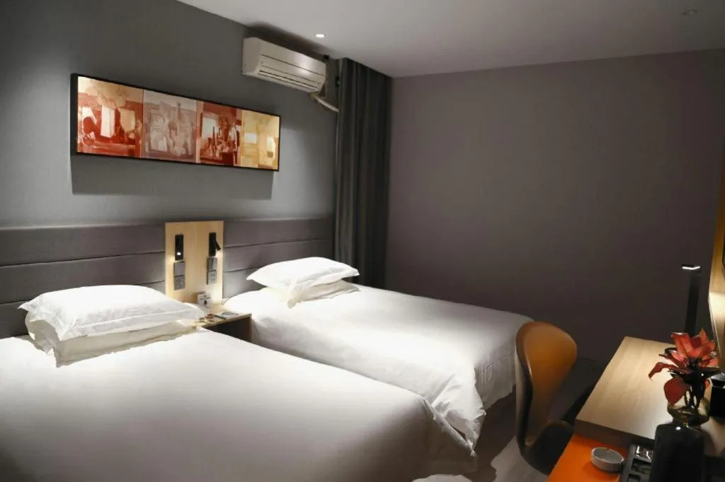 Bed in Jinjiang Inn Taizhou Huangyan Jiufeng Park