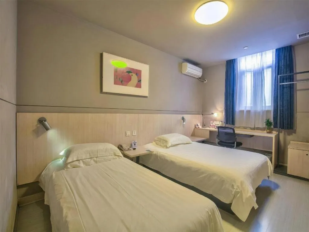 Bed in Jinjiang Inn Taizhou Huangyan Jiufeng Park