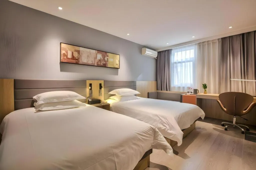 Bed in Jinjiang Inn Taizhou Huangyan Jiufeng Park