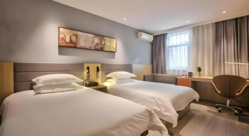 Bed in Jinjiang Inn Taizhou Huangyan Jiufeng Park