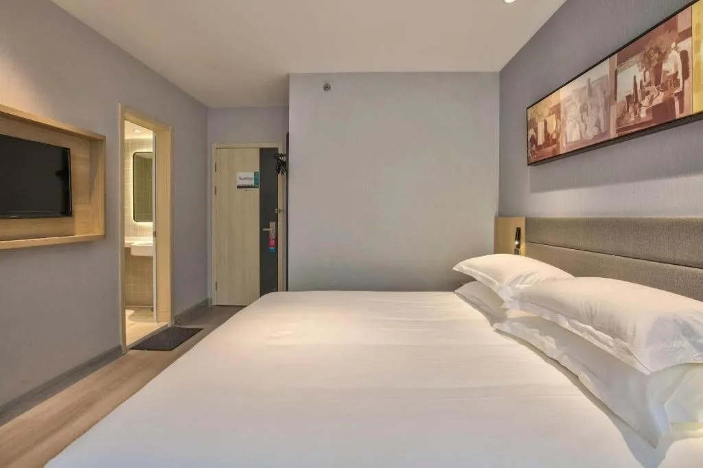 Bed in Jinjiang Inn Taizhou Huangyan Jiufeng Park