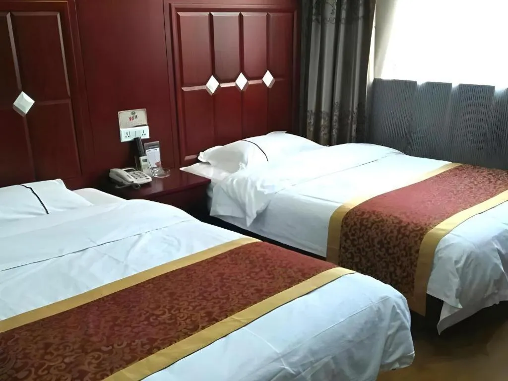 Bed in Shell Hotel Taiyuan South Railway Station New Southeast Bus Station