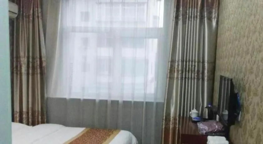 Bed in Shell Hotel Taiyuan South Railway Station New Southeast Bus Station