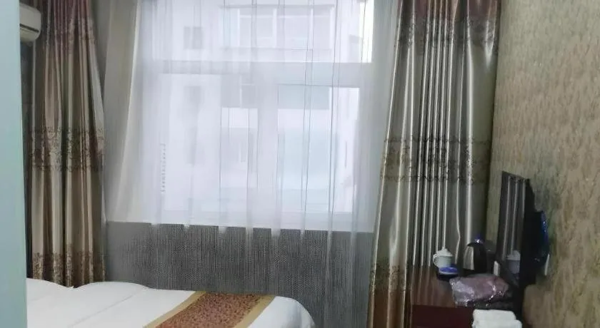 Bed in Shell Hotel Taiyuan South Railway Station New Southeast Bus Station