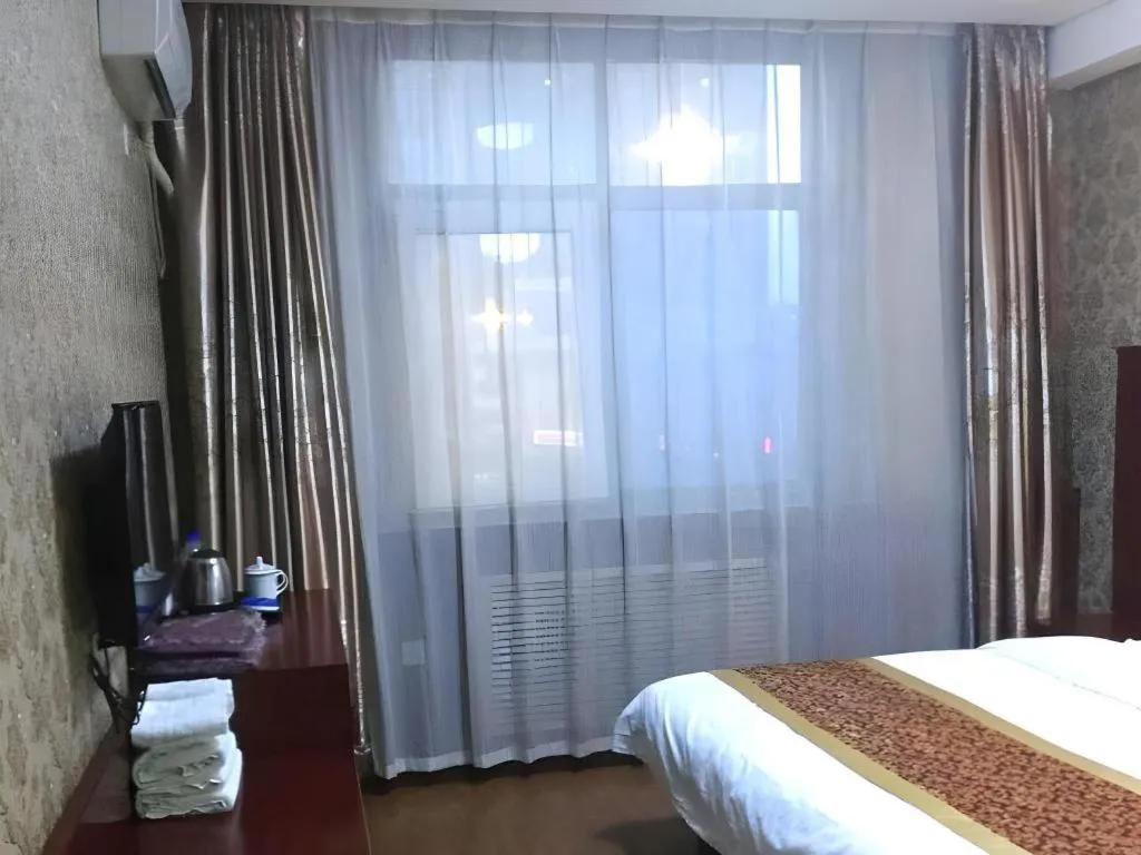 Bed in Shell Hotel Taiyuan South Railway Station New Southeast Bus Station