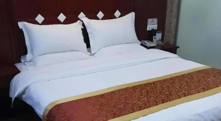 Bed in Shell Hotel Taiyuan South Railway Station New Southeast Bus Station