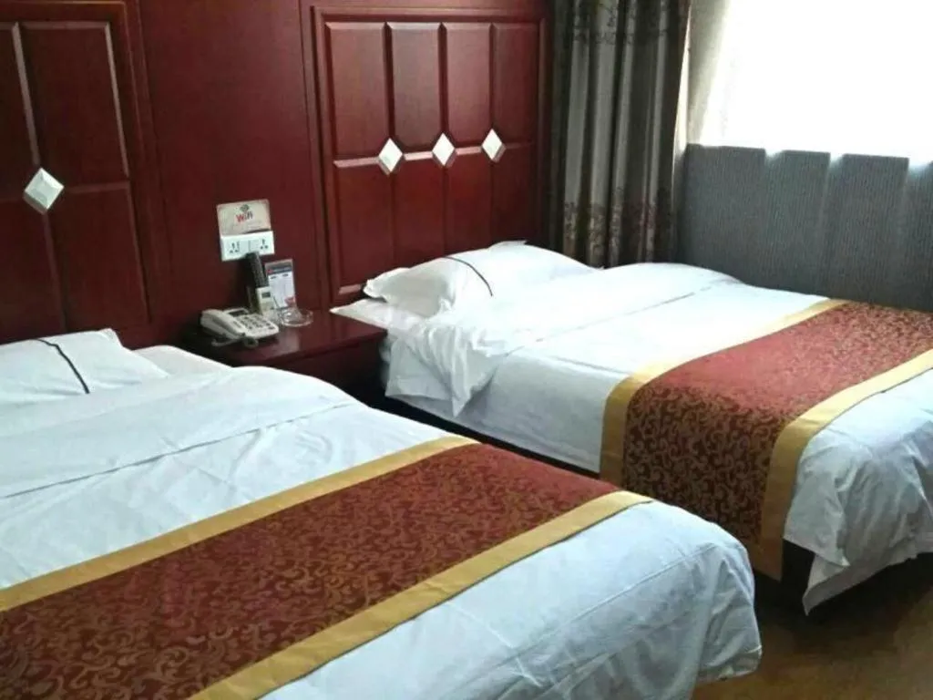 Bed in Shell Hotel Taiyuan South Railway Station New Southeast Bus Station