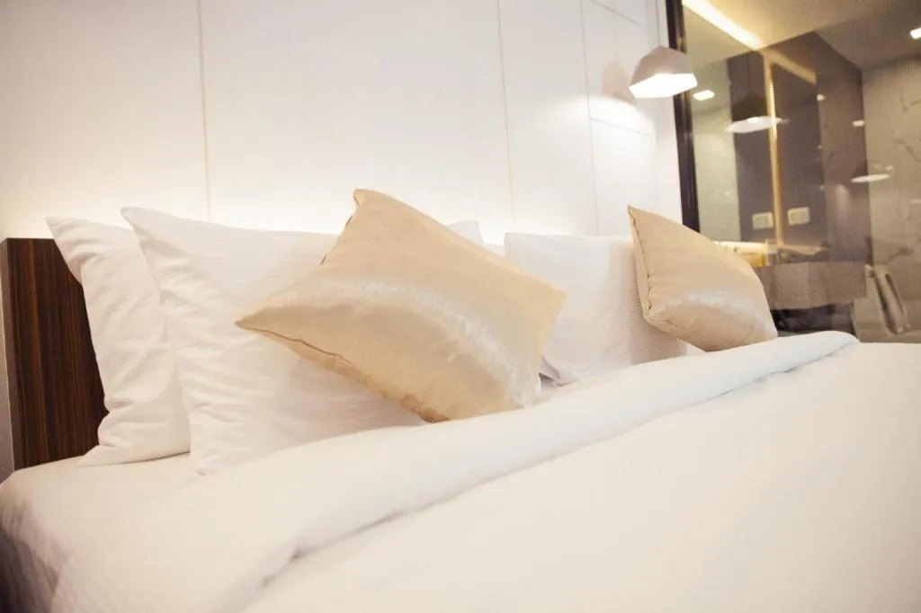 Bed in Thaisun Bangkok Hotel