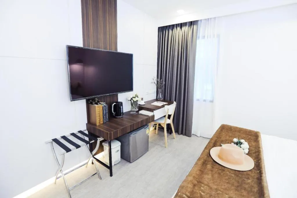 Bed in Thaisun Bangkok Hotel