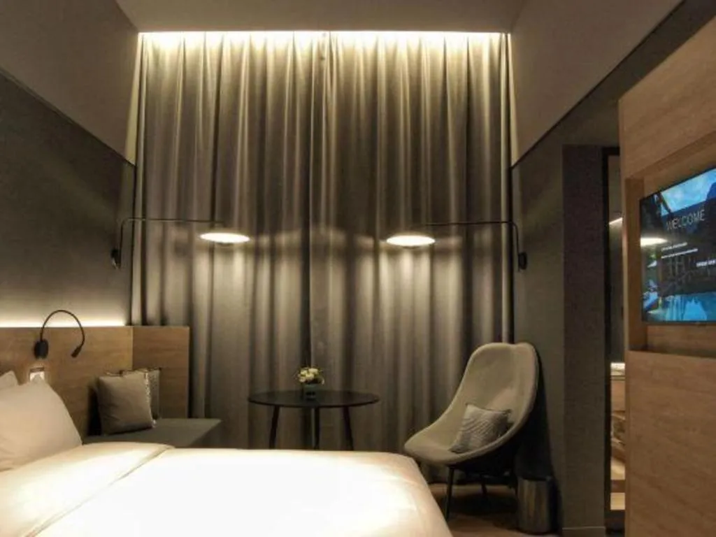 Bed in Opus Hotel Jiangmen