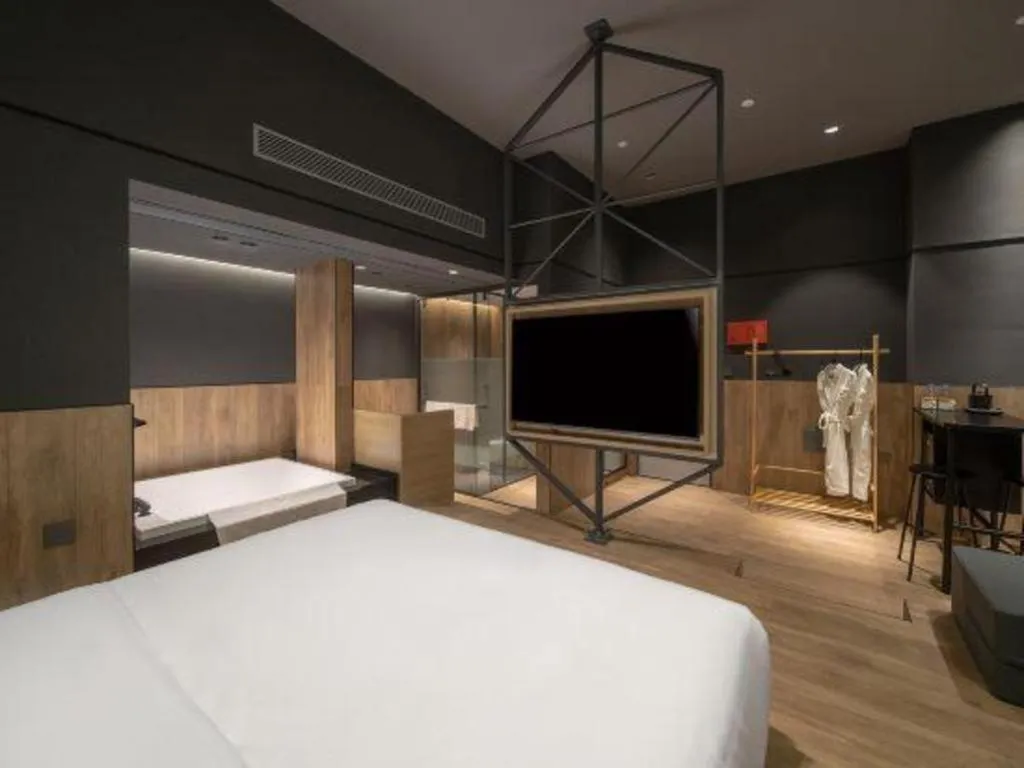 Bed in Opus Hotel Jiangmen