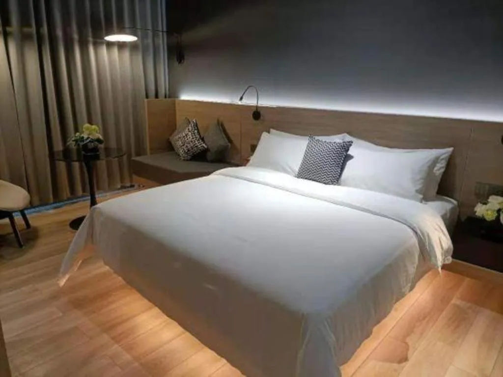 Bed in Opus Hotel Jiangmen