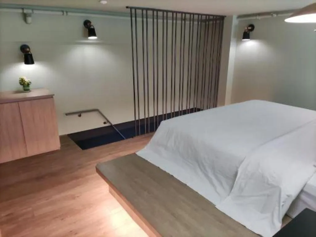 Bed in Opus Hotel Jiangmen