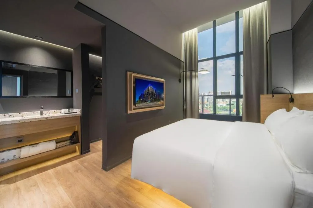 Bed in Opus Hotel Jiangmen