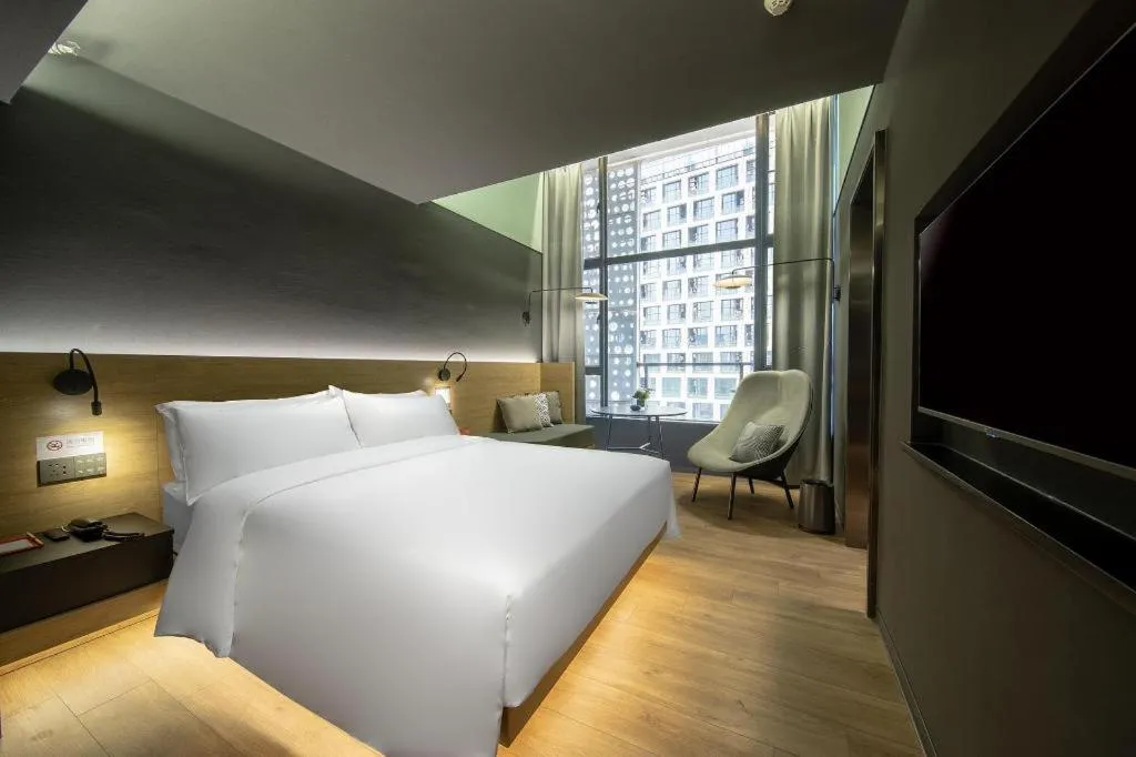 Bed in Opus Hotel Jiangmen