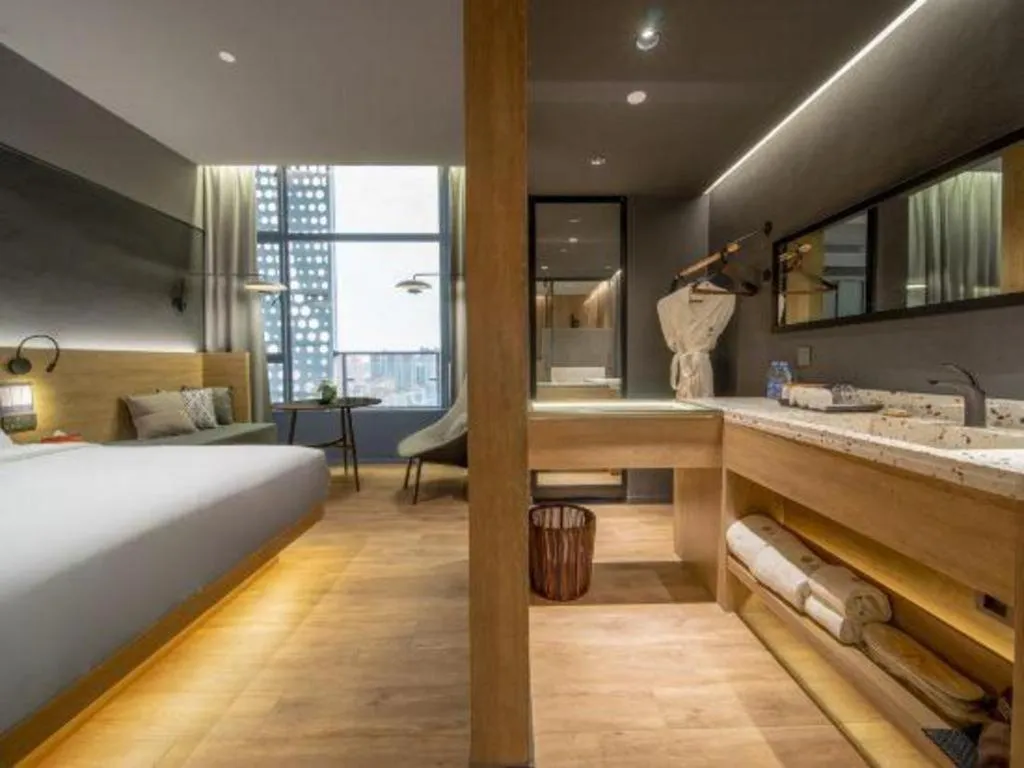 Bed in Opus Hotel Jiangmen