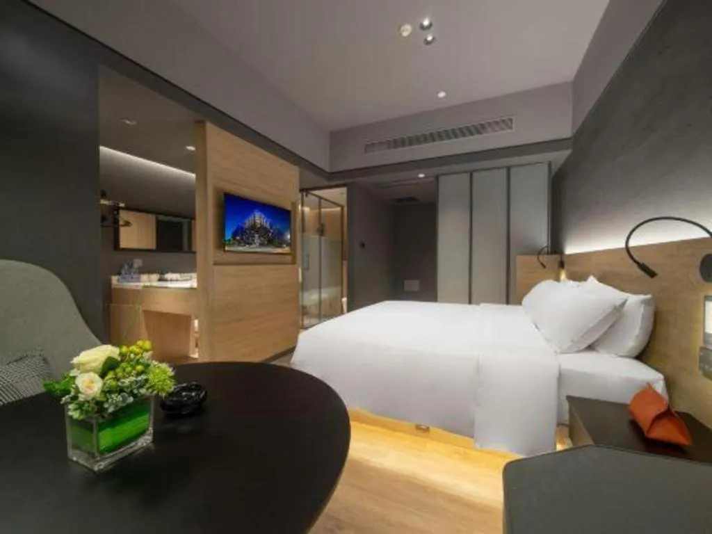 Bed in Opus Hotel Jiangmen