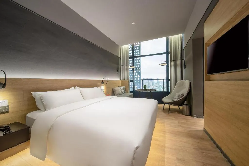 Bed in Opus Hotel Jiangmen