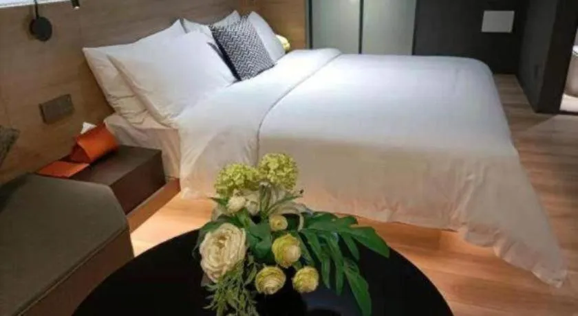 Bed in Opus Hotel Jiangmen