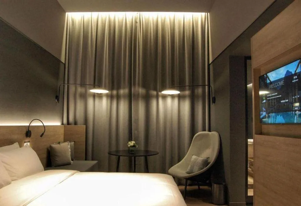 Bed in Opus Hotel Jiangmen