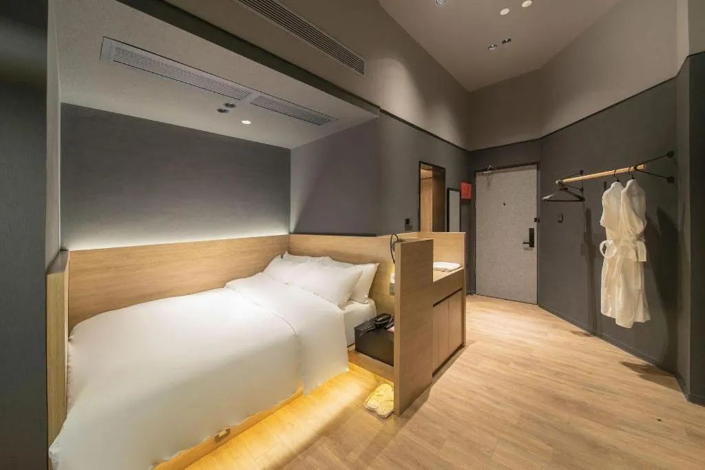 Bed in Opus Hotel Jiangmen