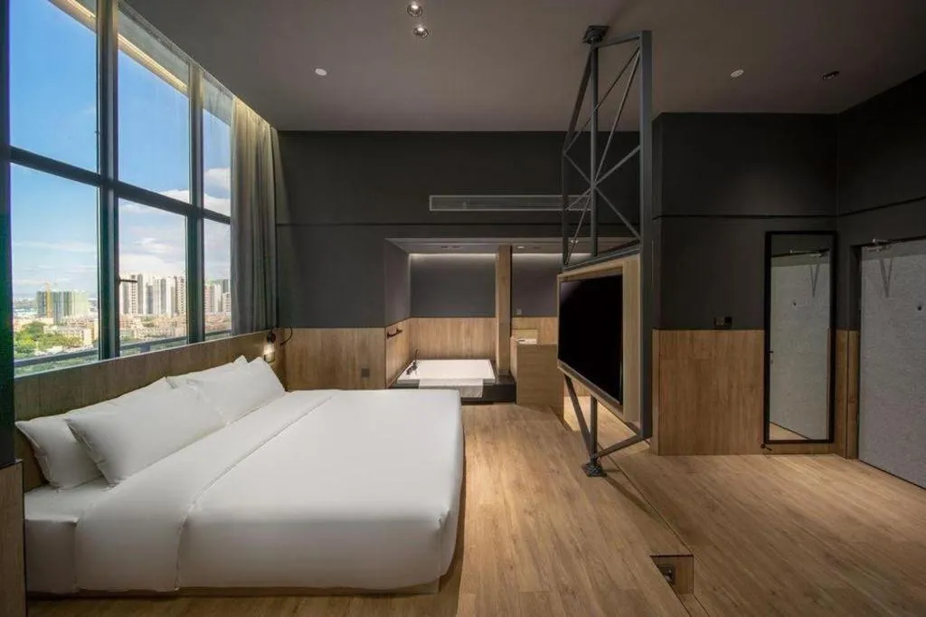 Bed in Opus Hotel Jiangmen