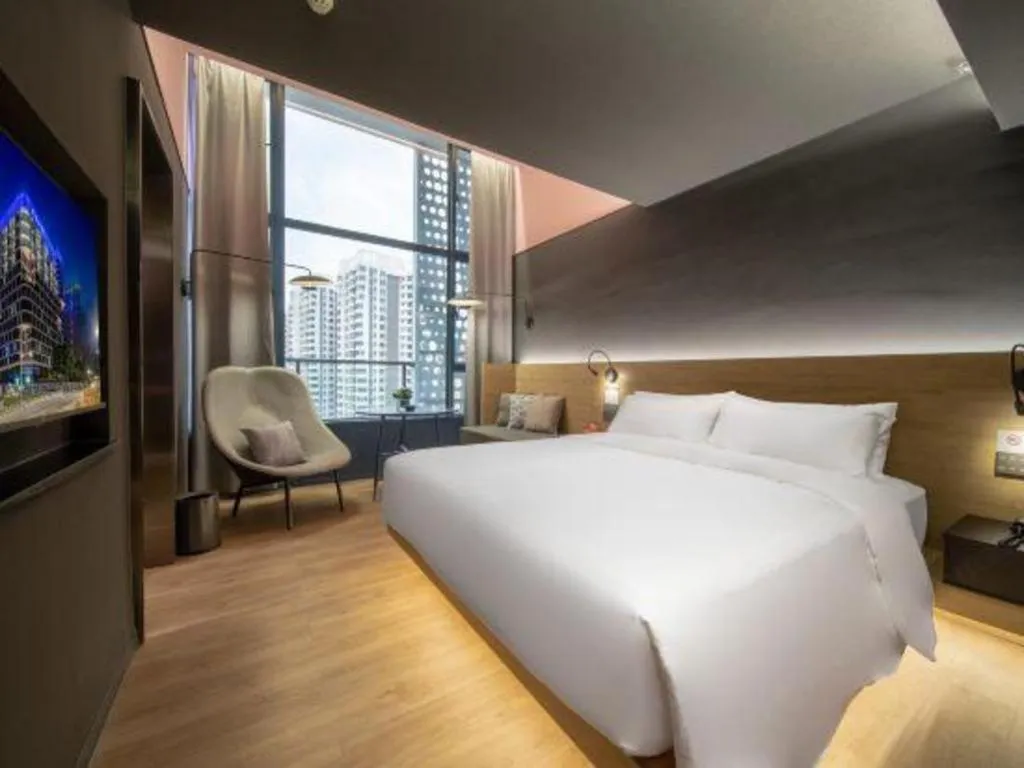 Bed in Opus Hotel Jiangmen