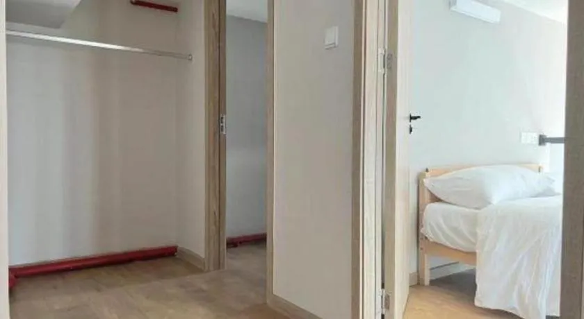 Bed in Opus Hotel Jiangmen