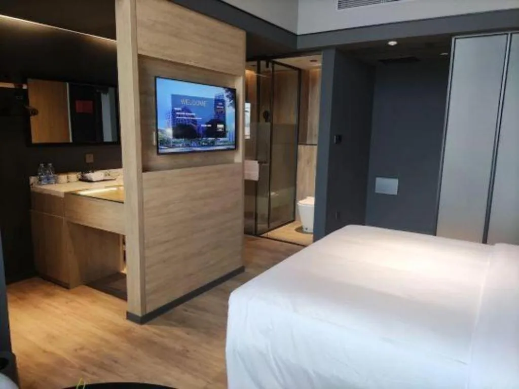 Bed in Opus Hotel Jiangmen