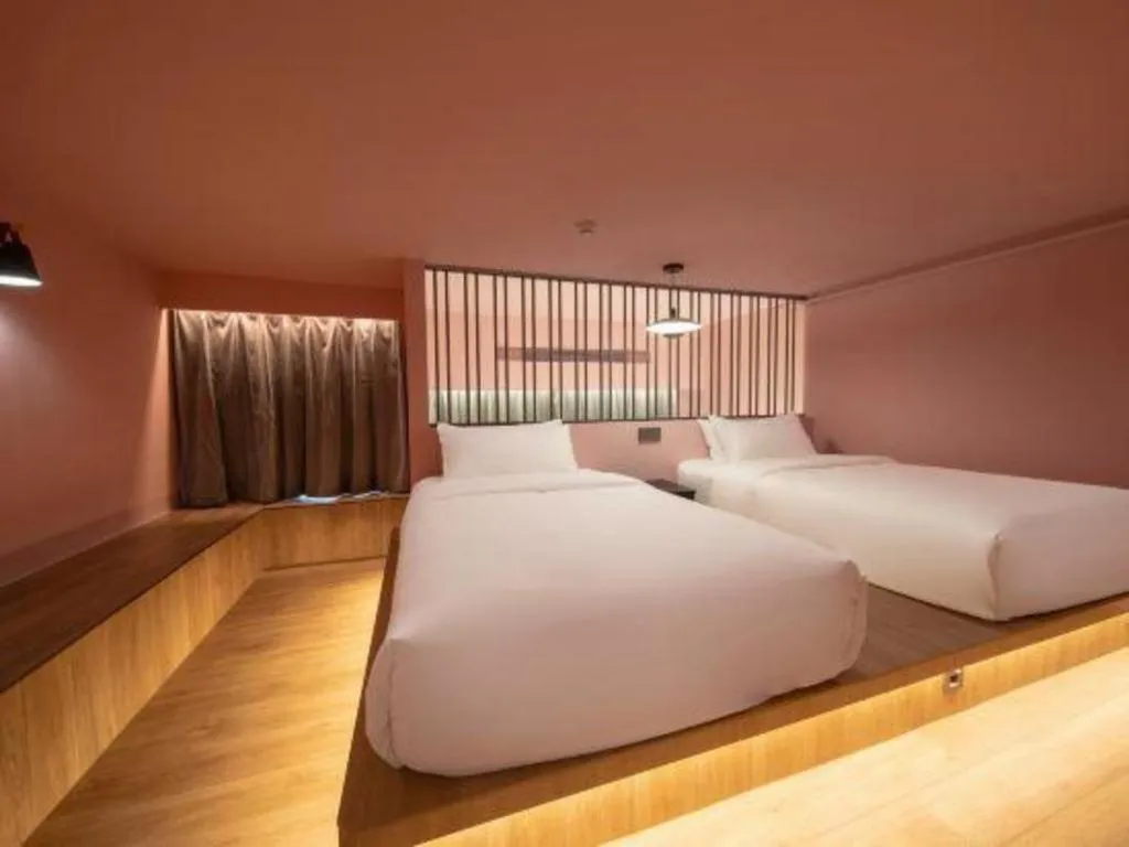 Bed in Opus Hotel Jiangmen