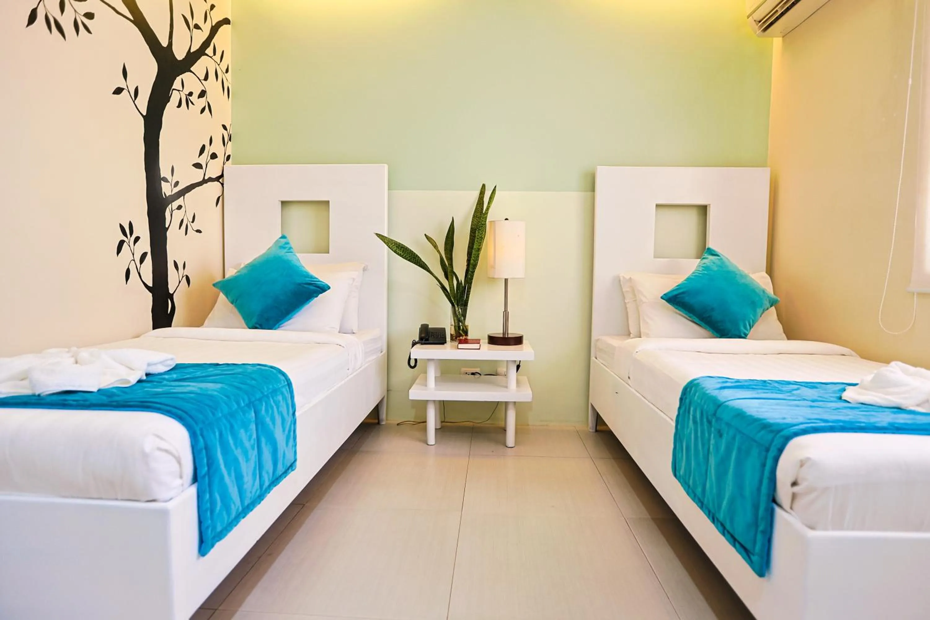 Bedroom, Bed in Holiday Suites Business District - formerly Empire Suites Hotel