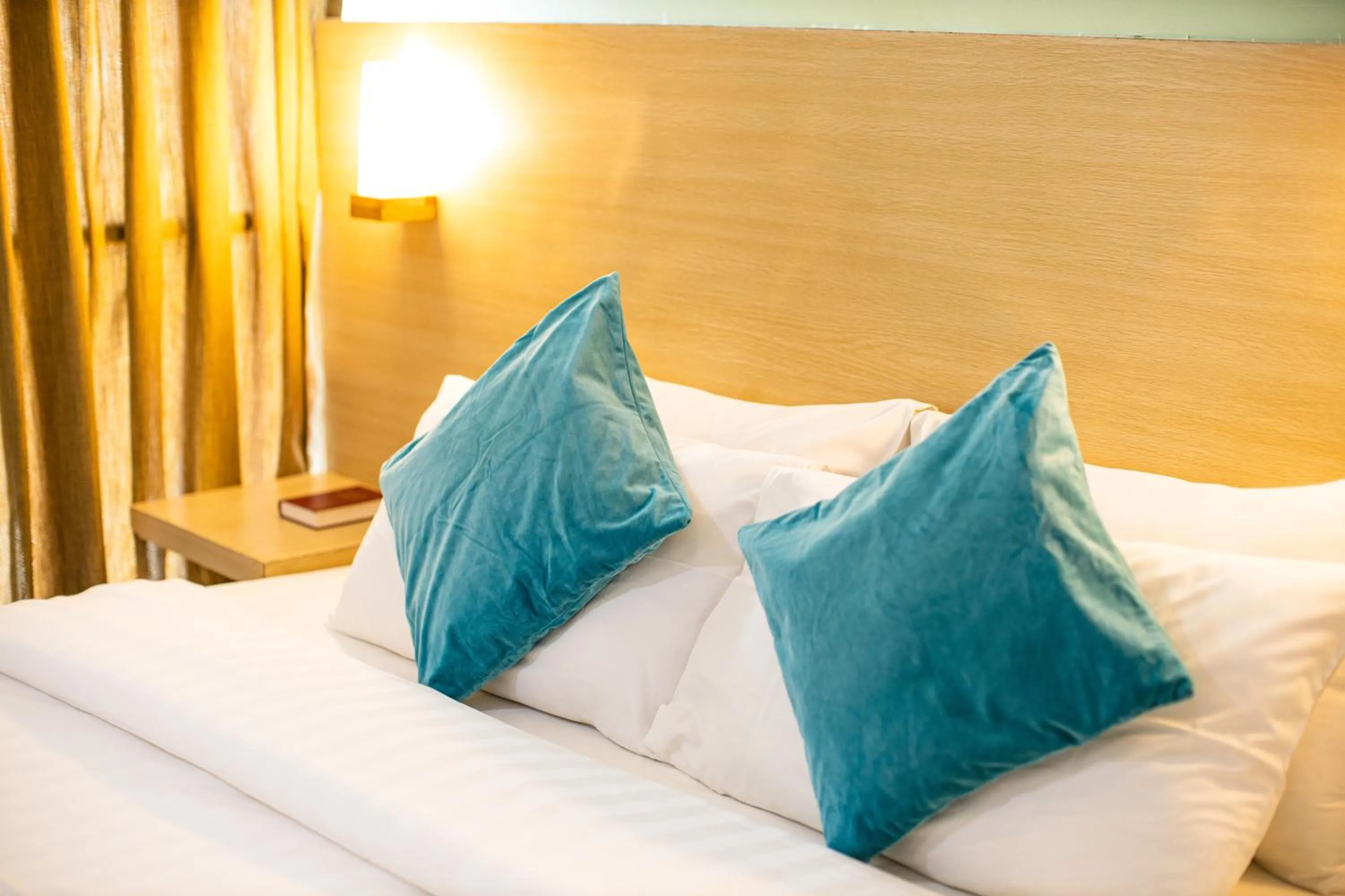 Bed in Holiday Suites Business District - formerly Empire Suites Hotel