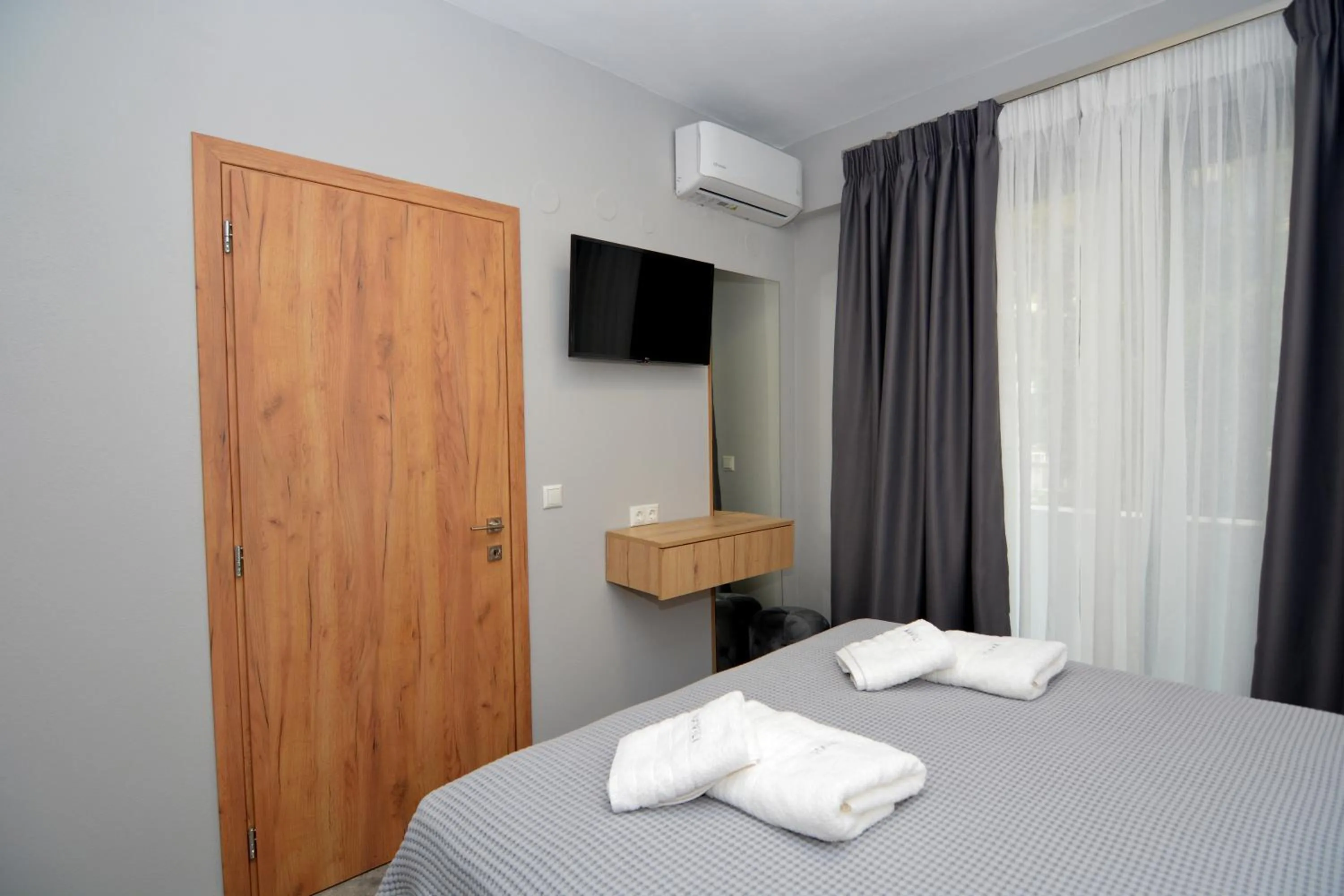 Bed in Mavili Luxury Apartments