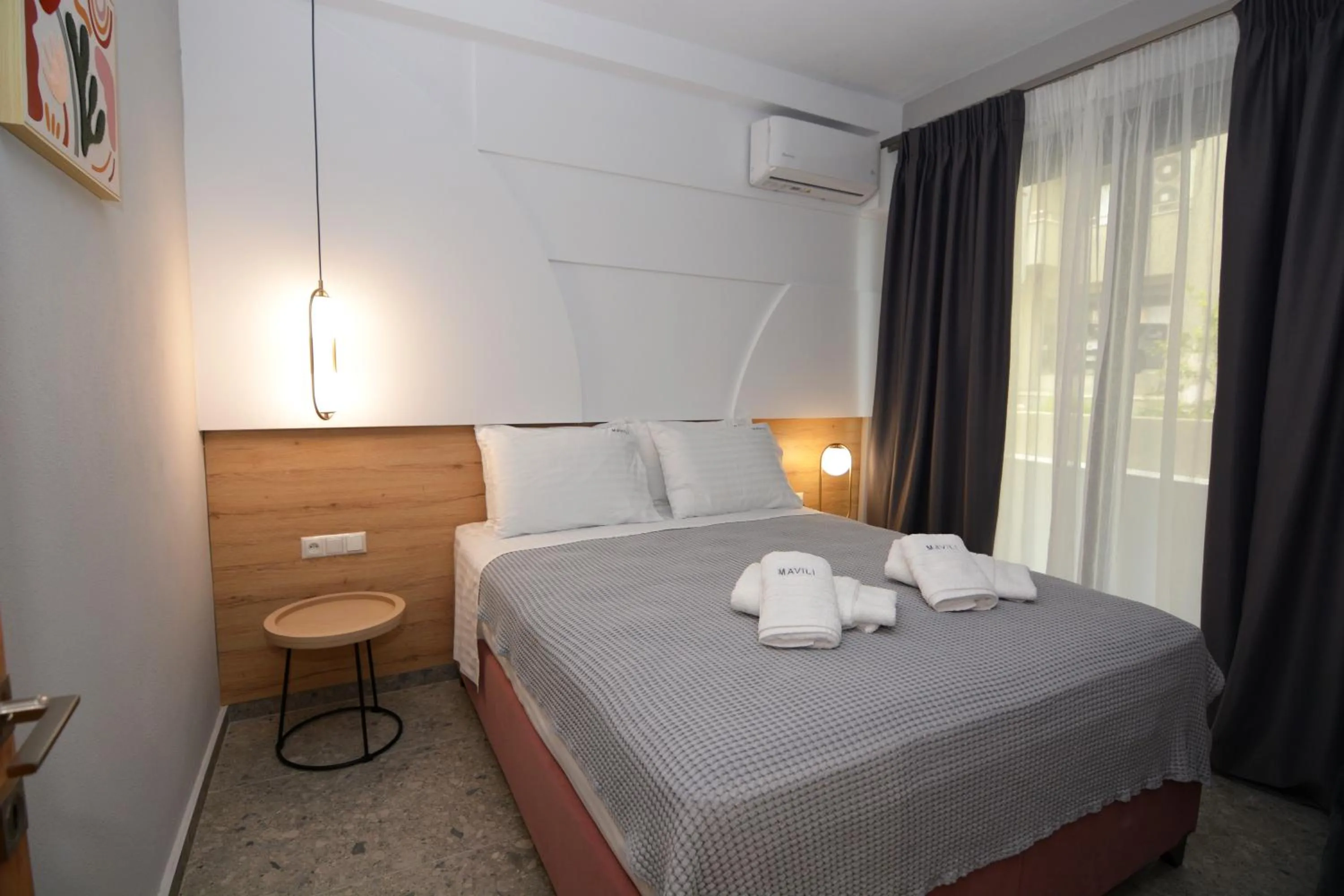 Bed in Mavili Luxury Apartments