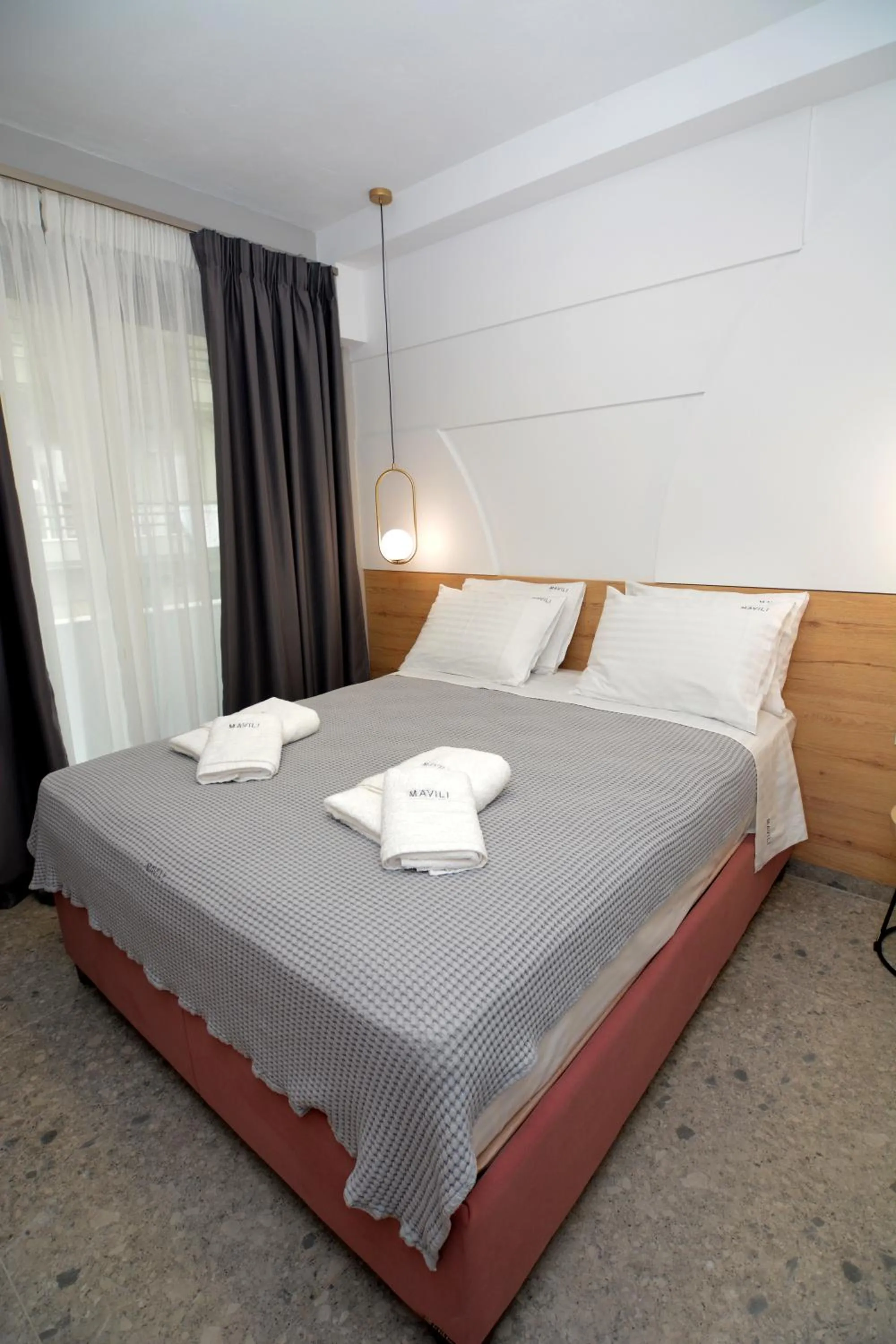 Bed in Mavili Luxury Apartments