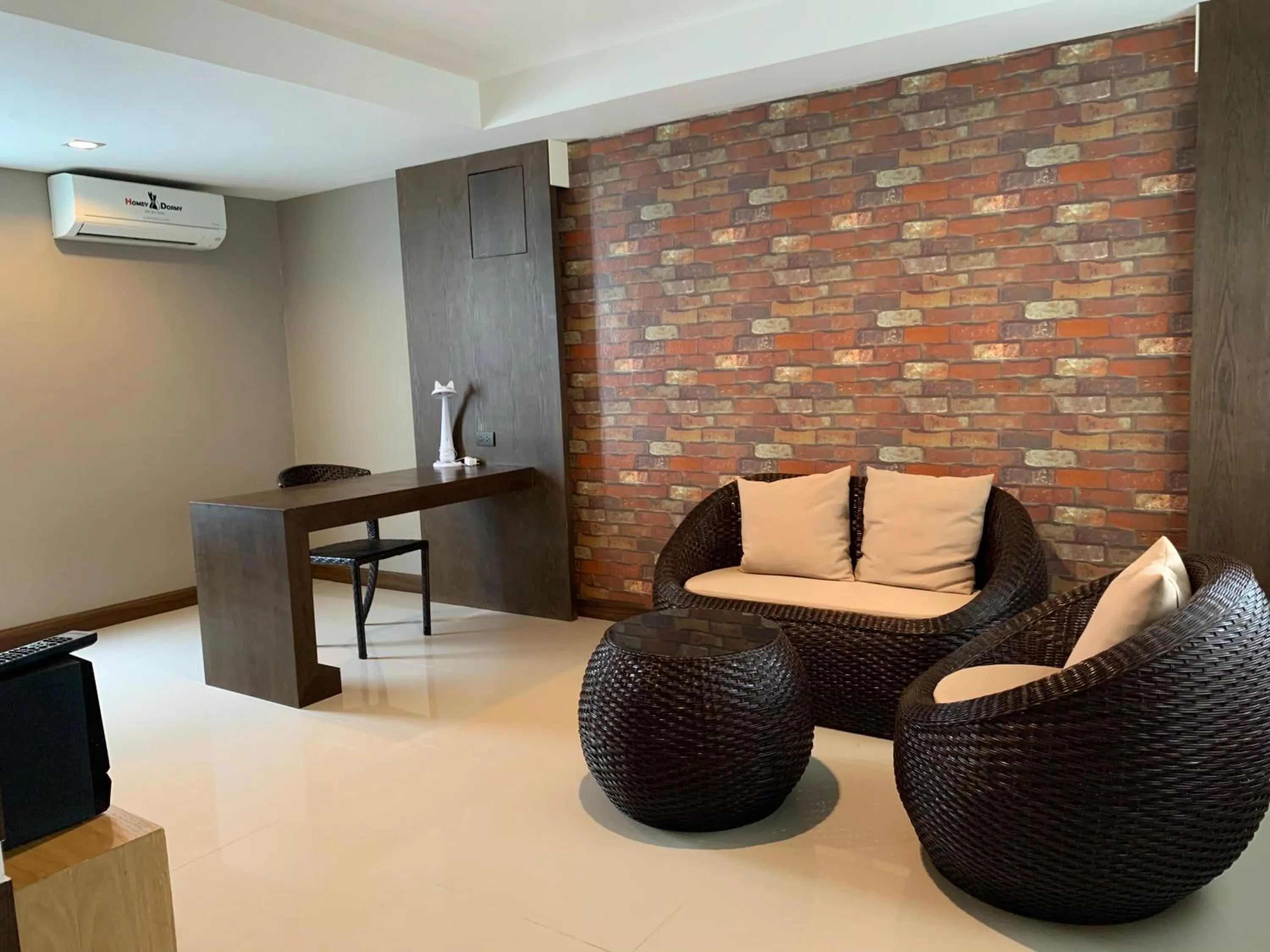 Seating area in Homey Dormy Chiangrai