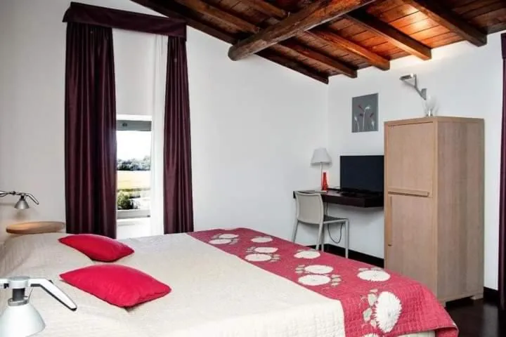 Bed in Relais Villa D'Assio