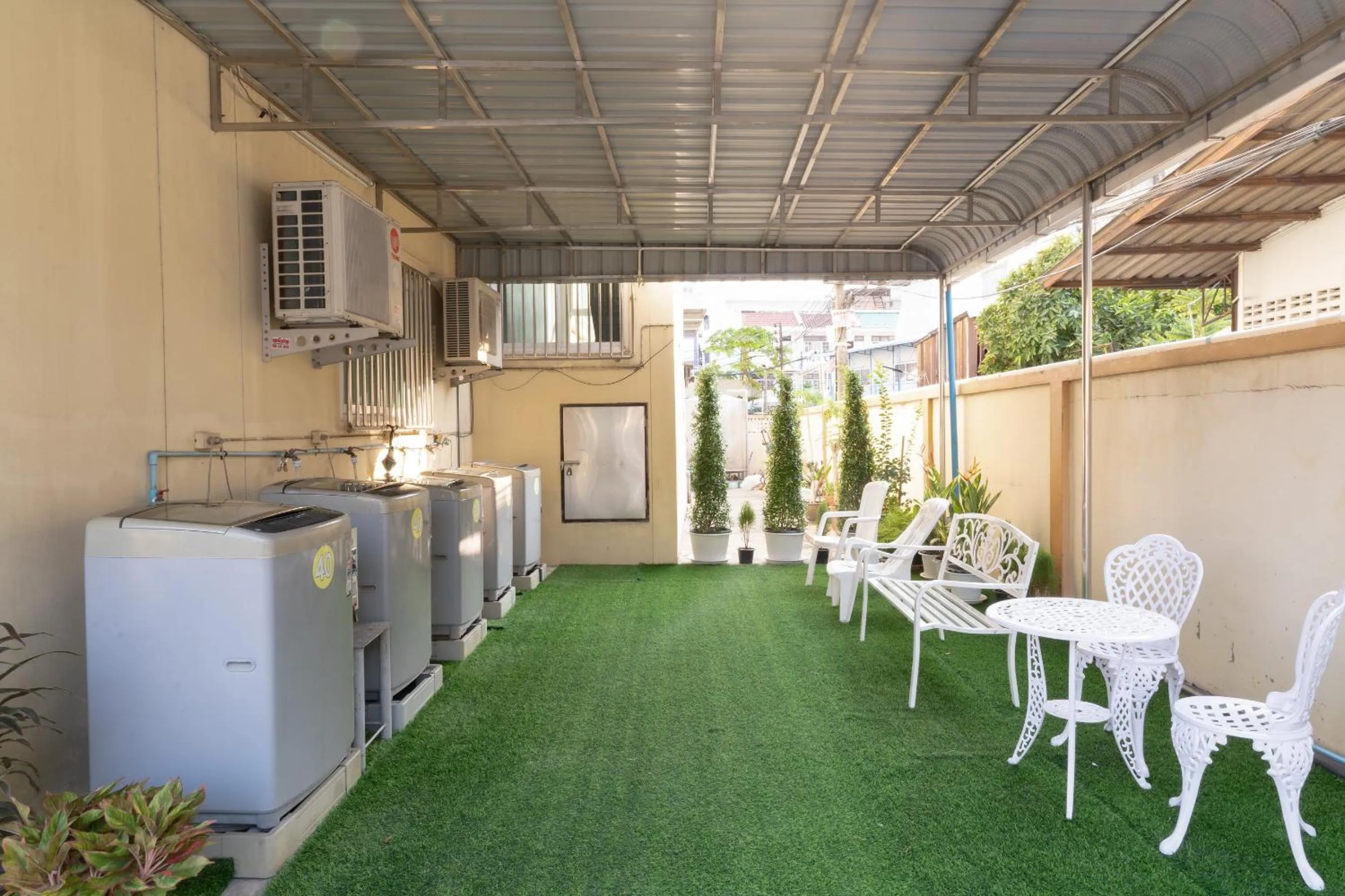 washing machine in Nicha Residence Hotel
