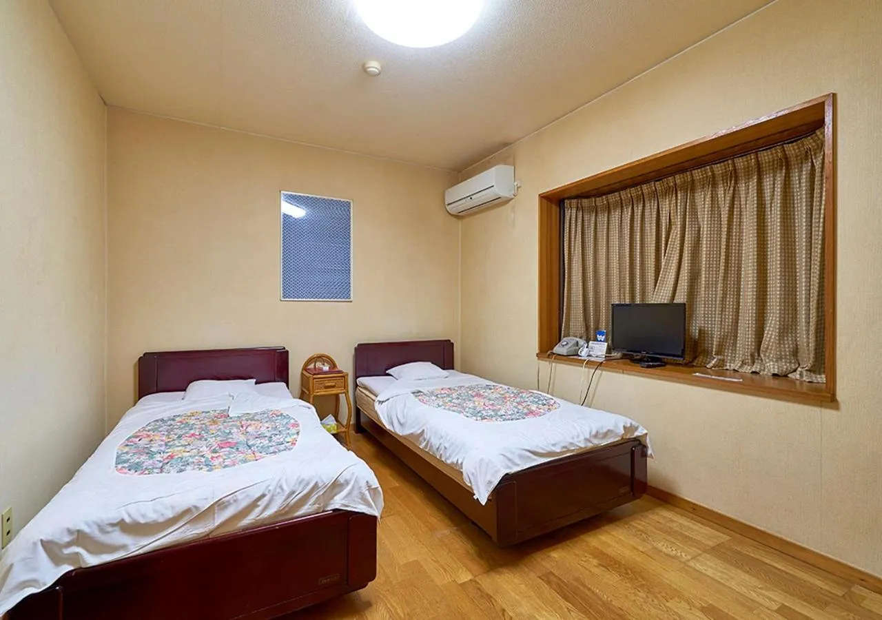 Bed in Shinwaka Lodge