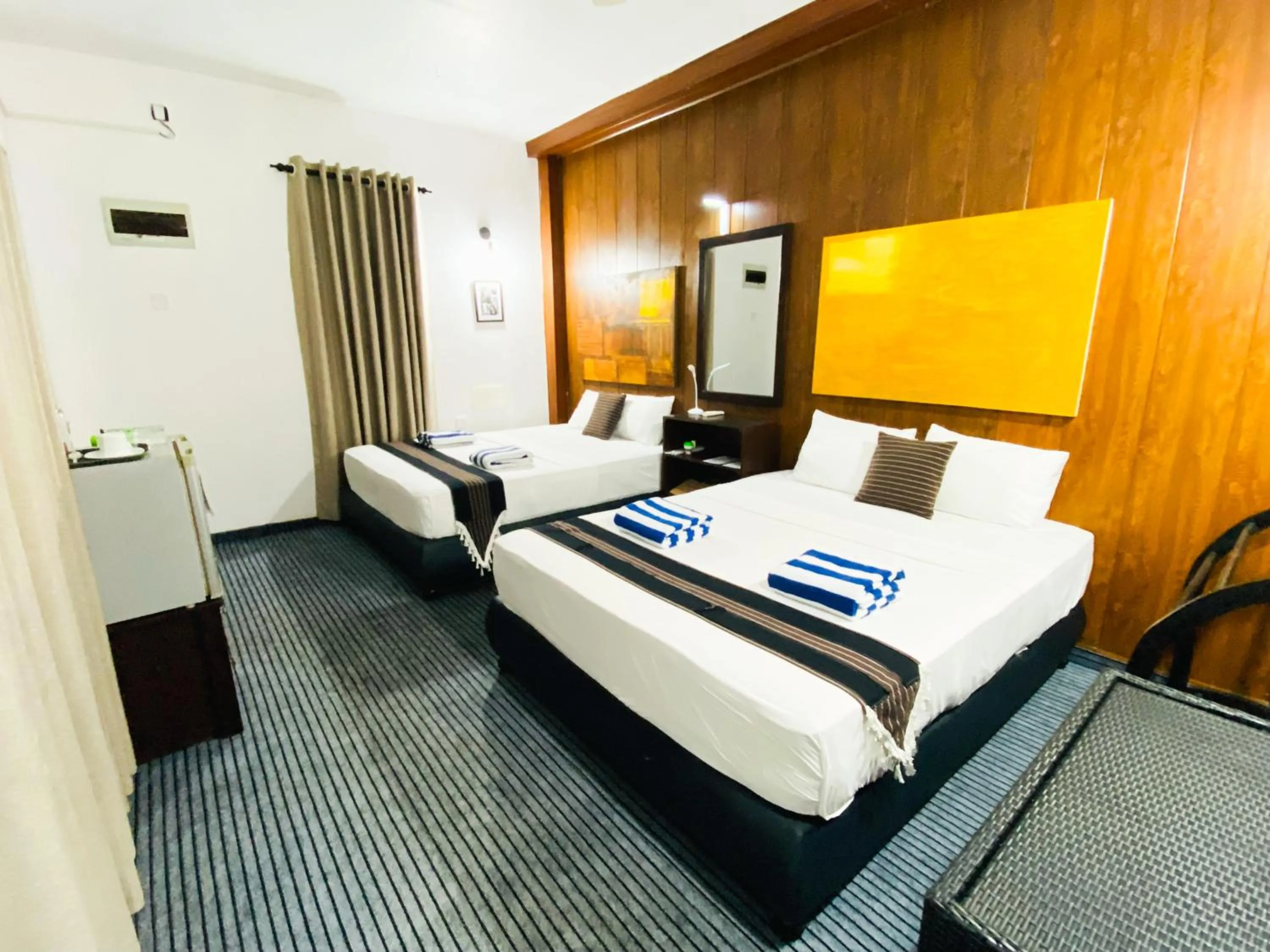 Bed in Coco Palm Villa and Cabanas