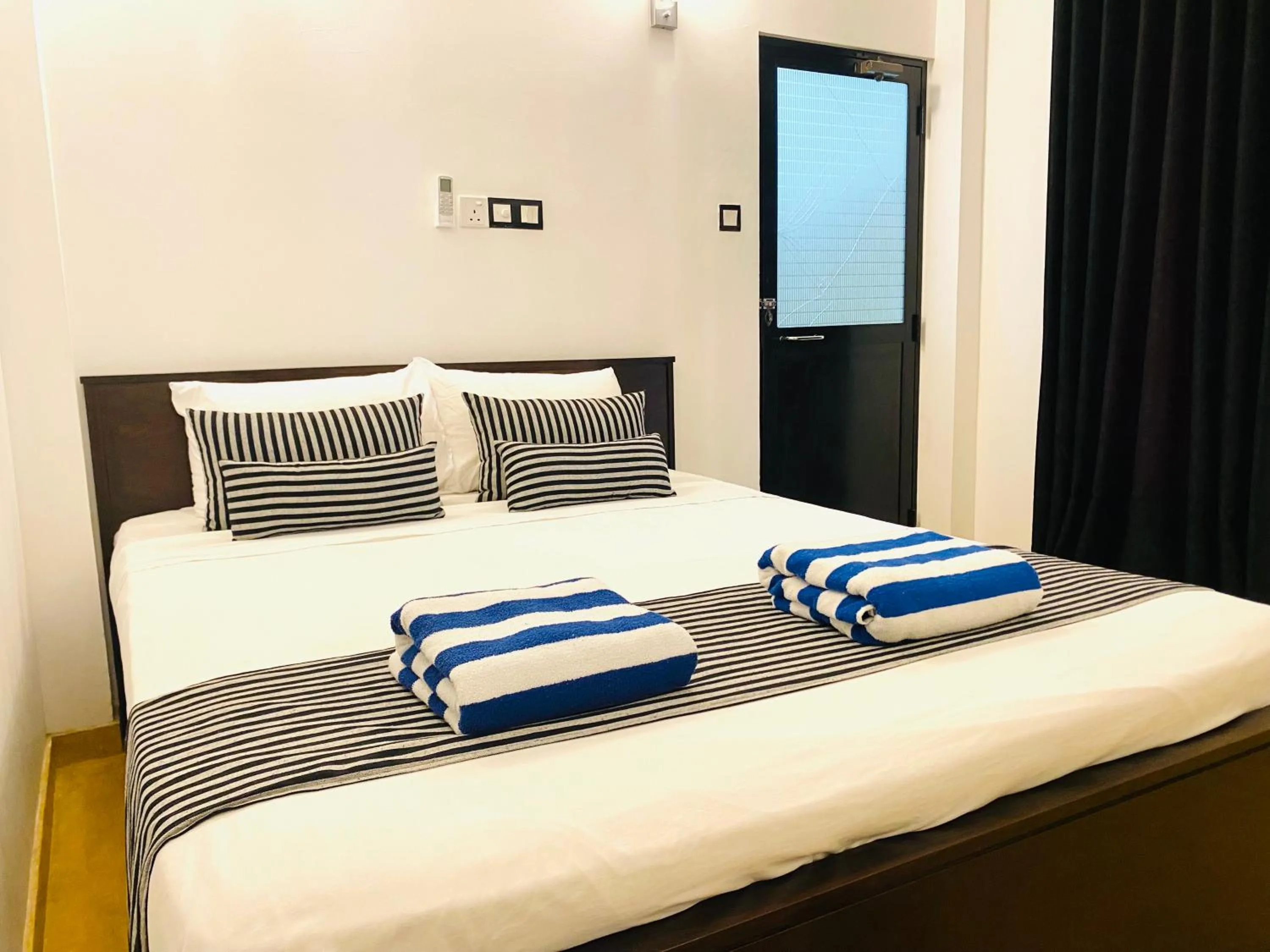 Bed in Coco Palm Villa and Cabanas