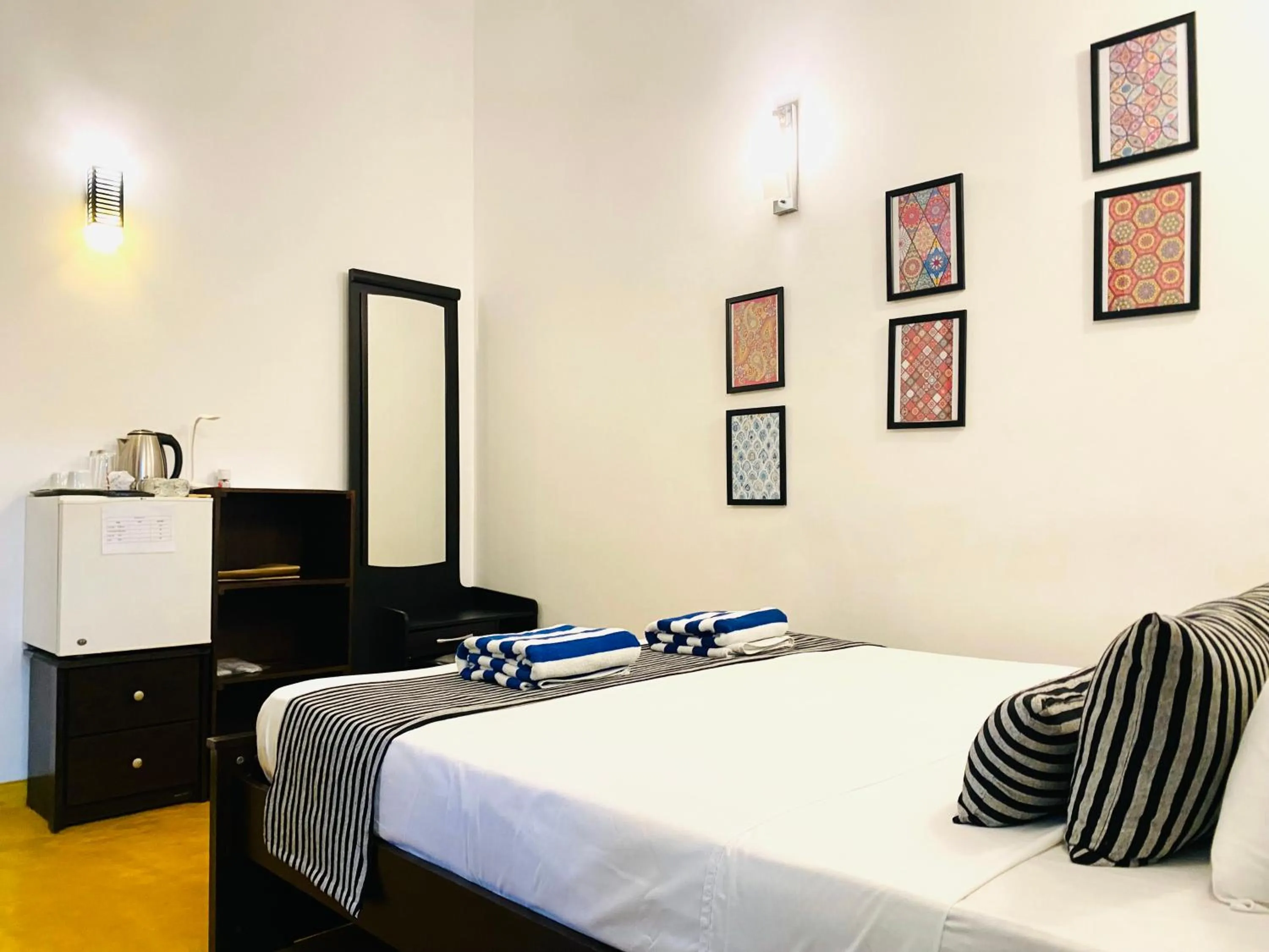 Bed in Coco Palm Villa and Cabanas