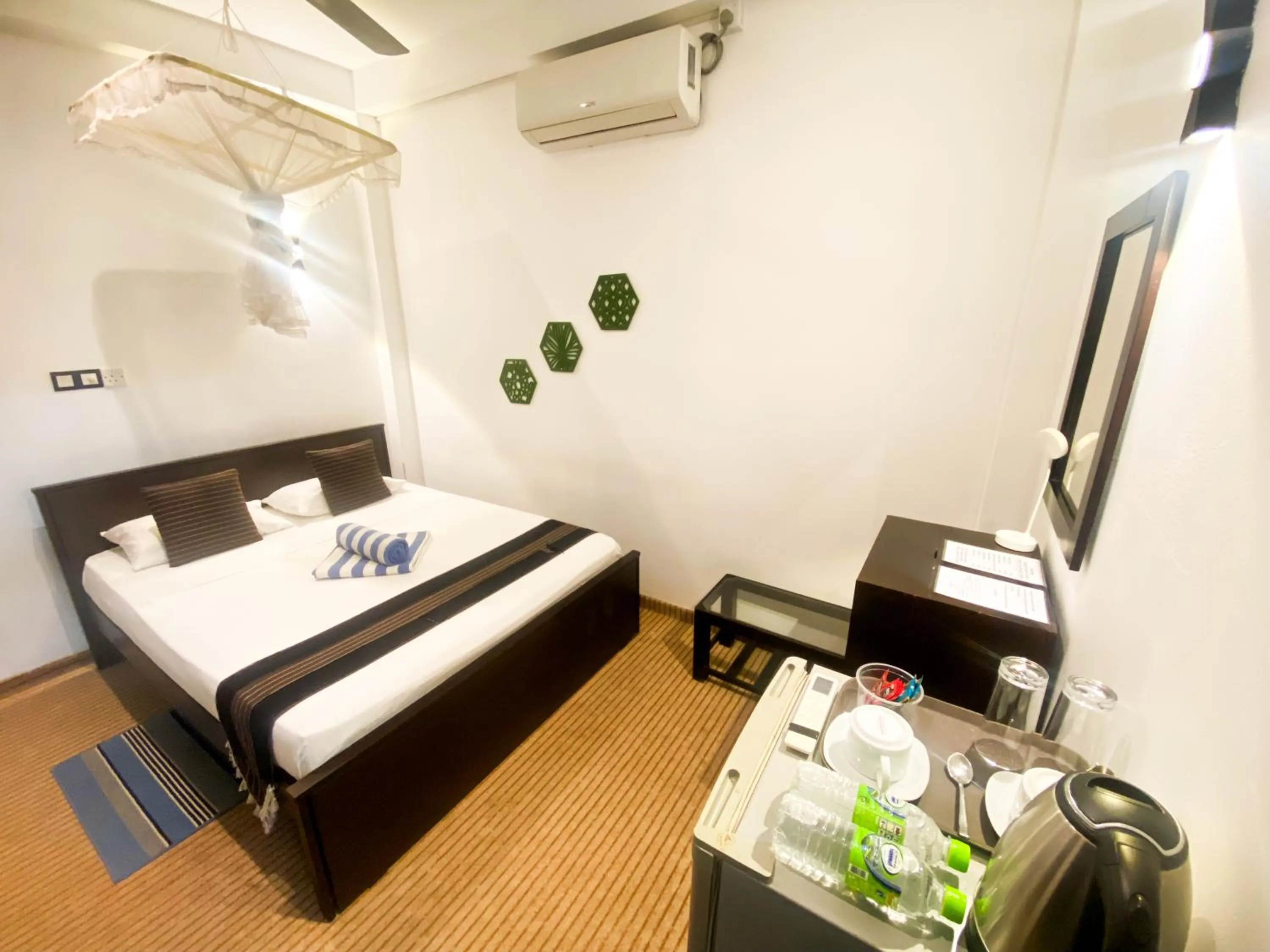 Bed in Coco Palm Villa and Cabanas