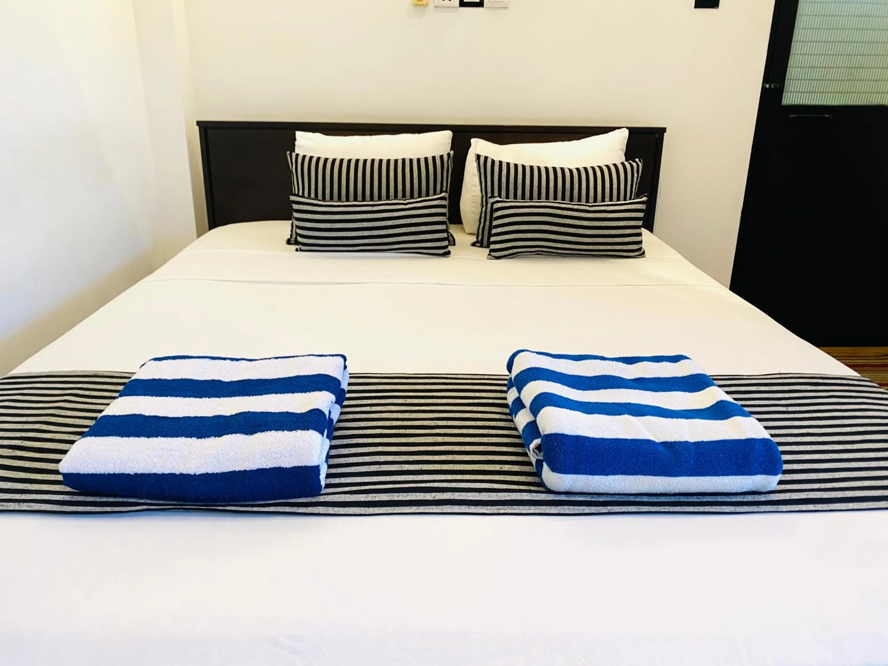 Bed in Coco Palm Villa and Cabanas