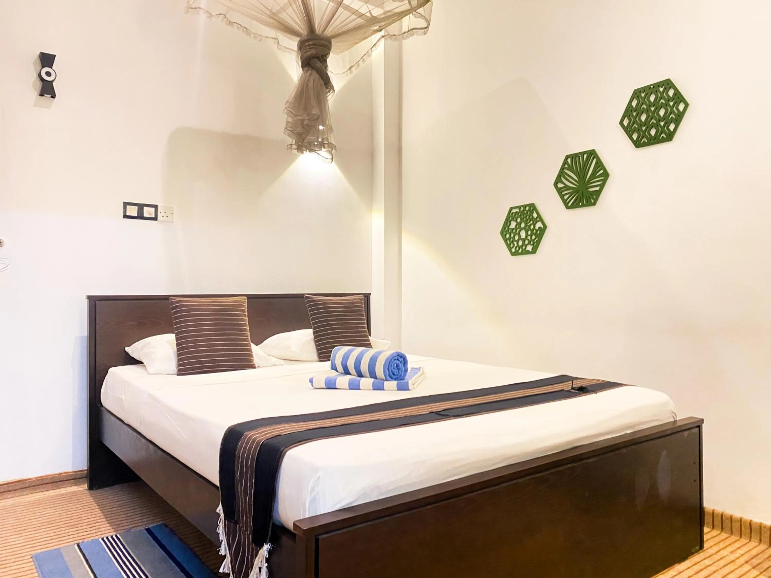 Bed in Coco Palm Villa and Cabanas