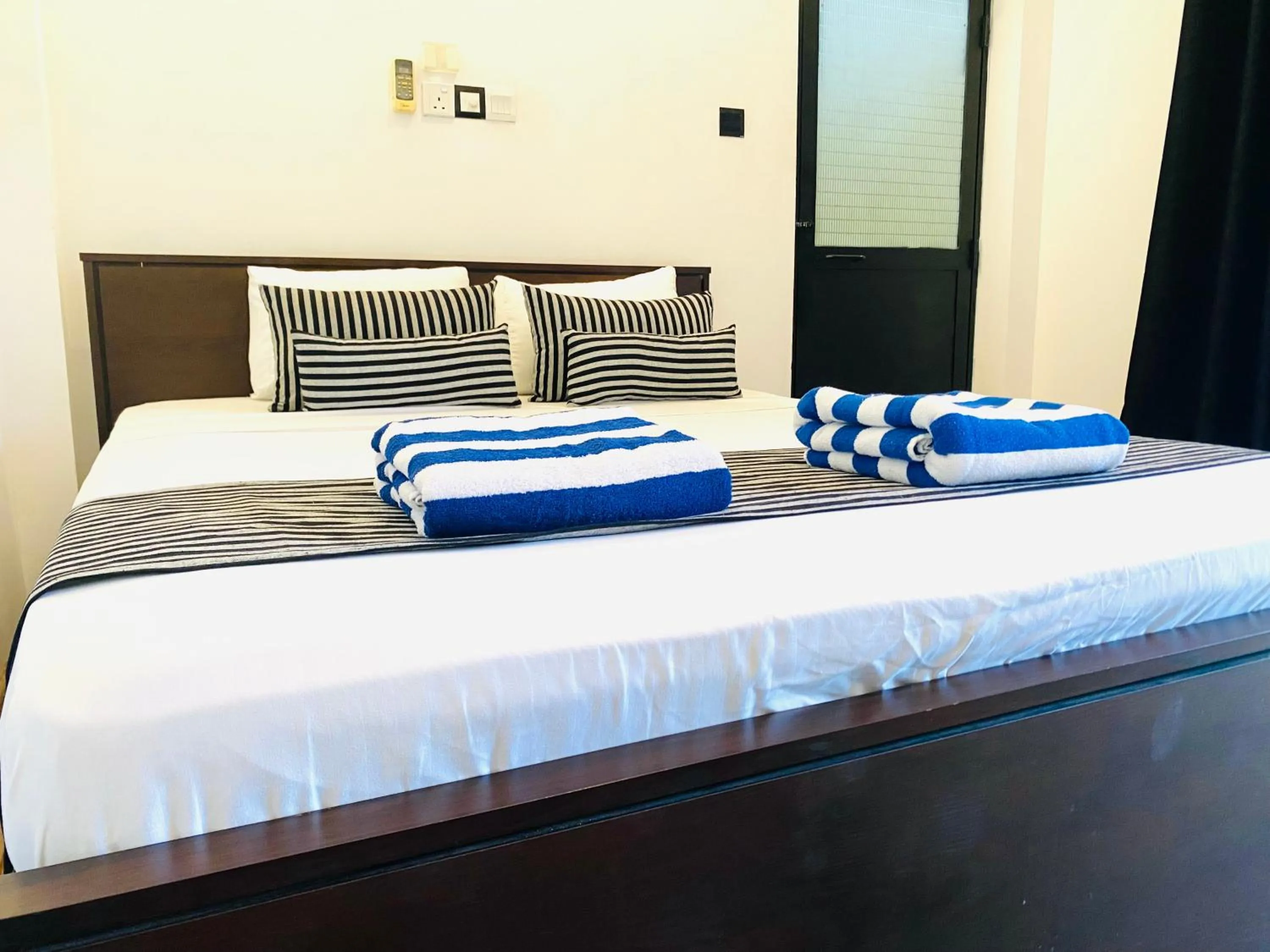 Bed in Coco Palm Villa and Cabanas