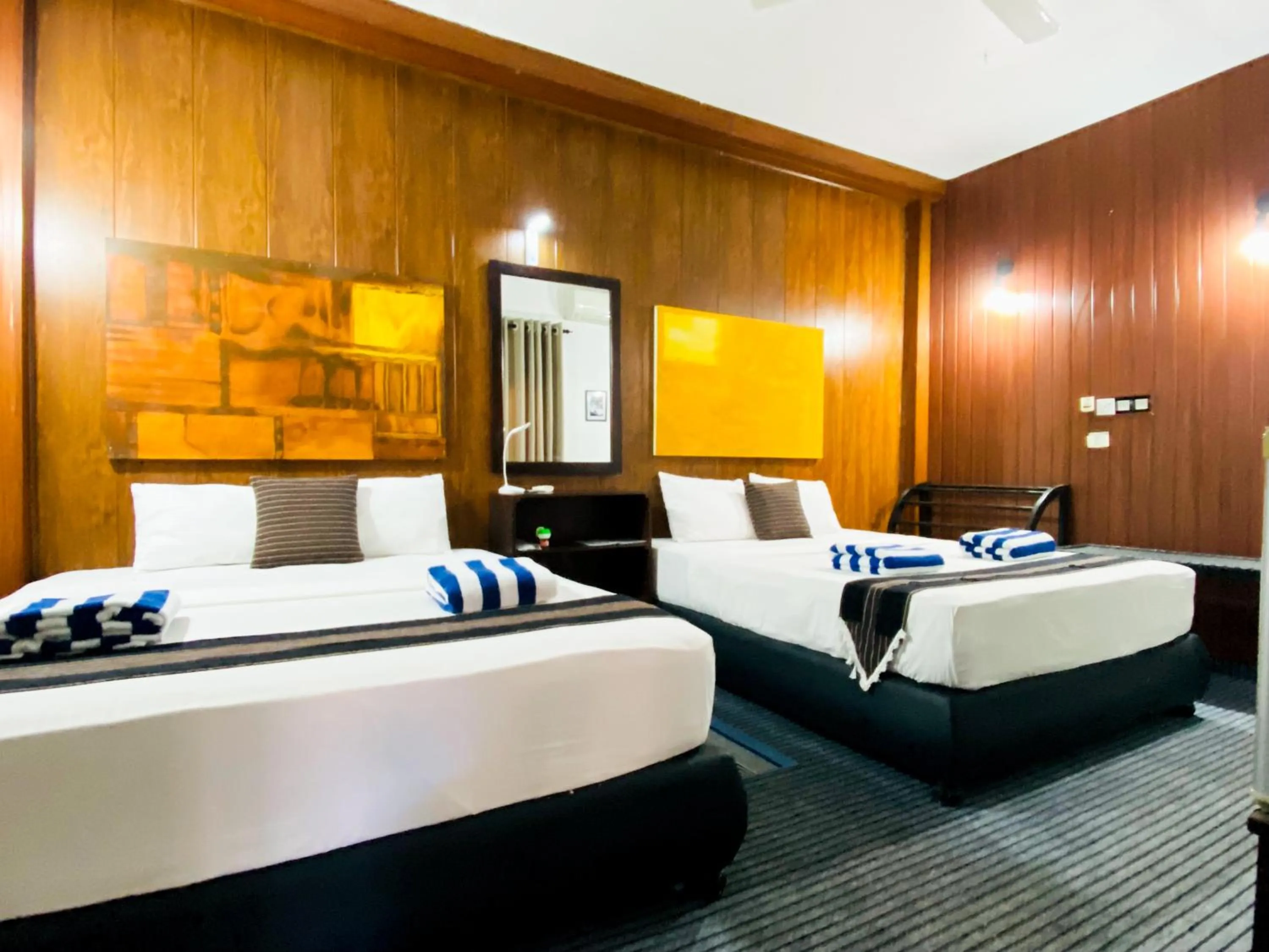 Bed in Coco Palm Villa and Cabanas